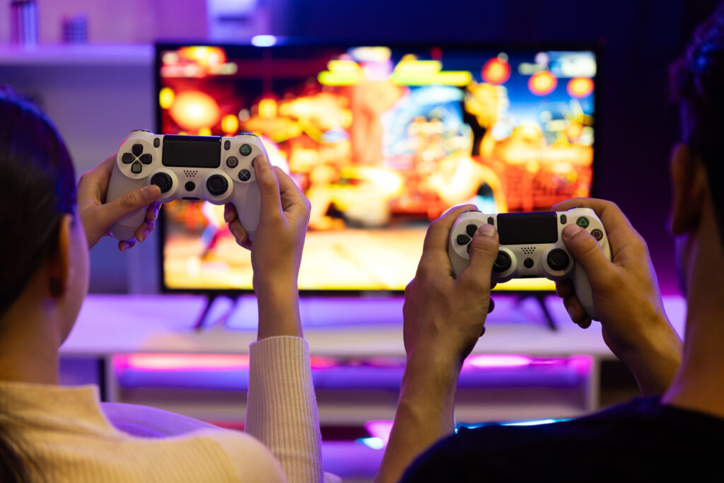 focus-hands-joyful-player-video-game-tv-using-joysticks-postulate
